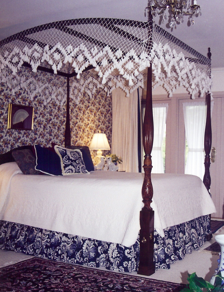 Example of a large classic master carpeted and white floor bedroom design in Other with multicolored walls