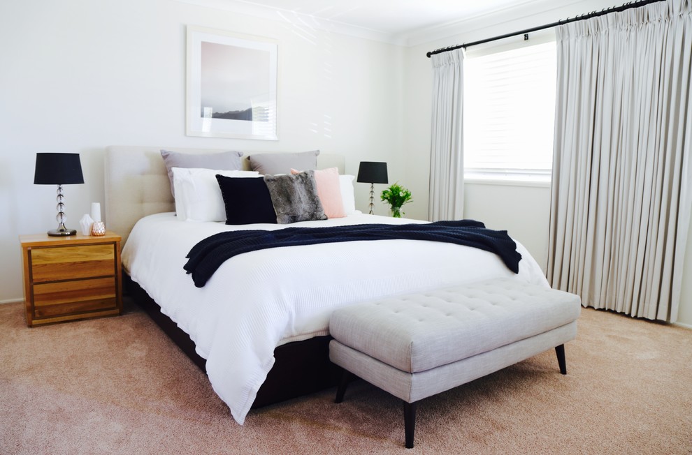 Inspiration for a large scandinavian master carpeted bedroom remodel in Sydney with white walls
