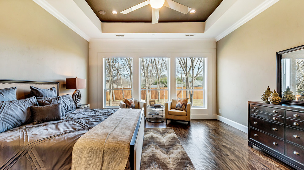 Example of a large transitional master medium tone wood floor bedroom design in Dallas