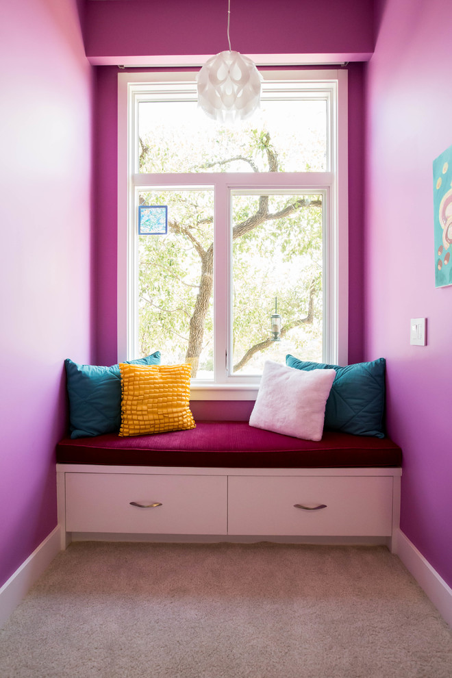 Inspiration for a large modern guest bedroom in Austin with pink walls, carpet, no fireplace and beige floors.