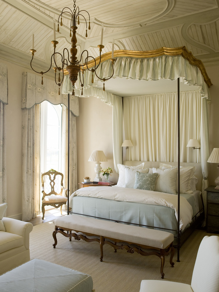 This is an example of a large traditional master bedroom in Atlanta with beige walls.