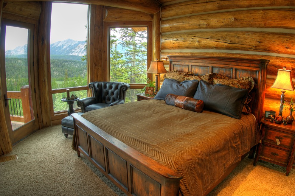 Photo of a rustic master bedroom in Other with brown walls.