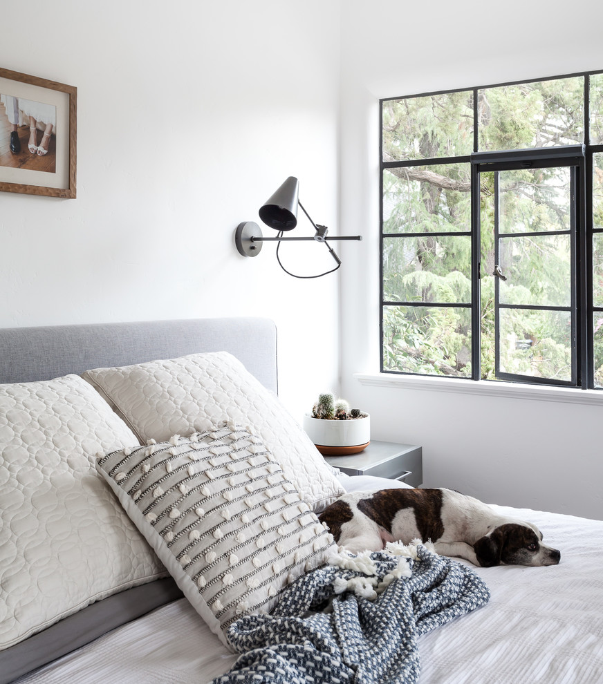 Bedroom - master medium tone wood floor and brown floor bedroom idea in Sacramento with white walls