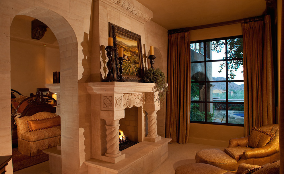 Example of a huge classic master terra-cotta tile bedroom design in Phoenix with brown walls, a two-sided fireplace and a stone fireplace