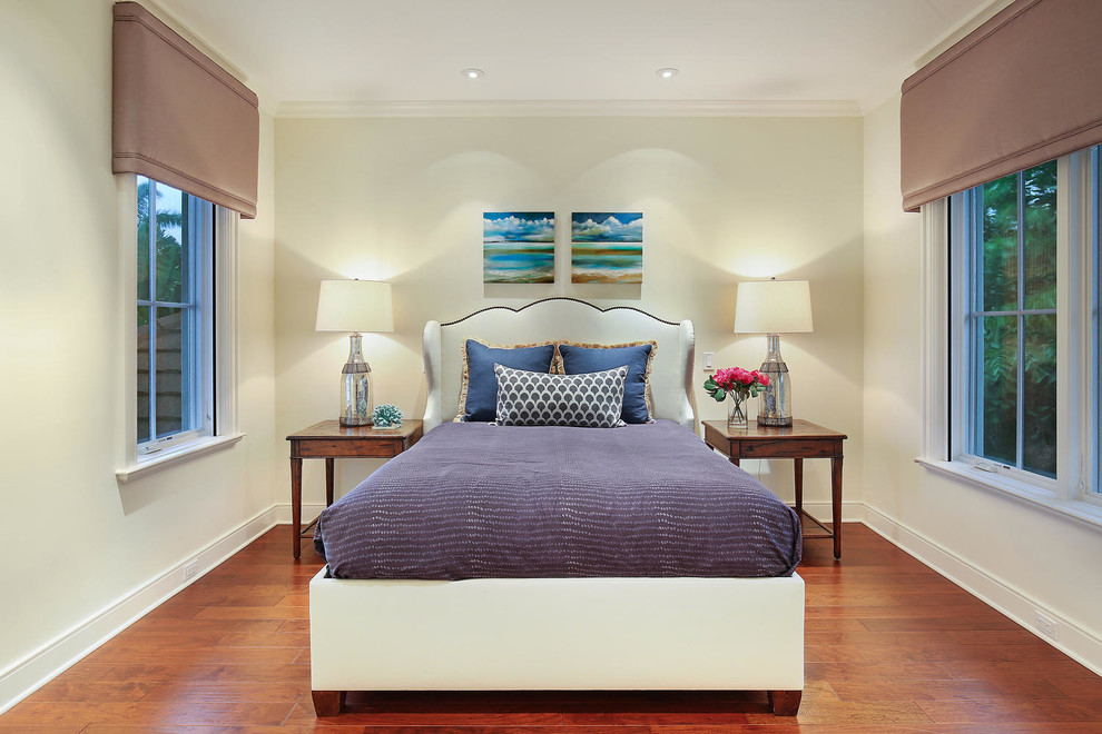 Photo of a large world-inspired guest bedroom in Tampa with beige walls and medium hardwood flooring.
