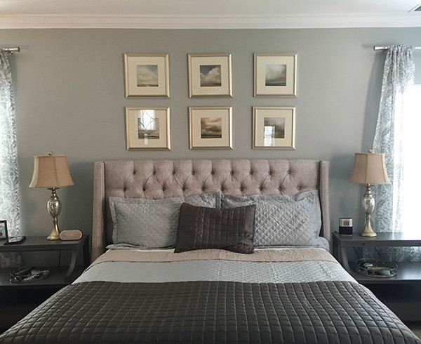 Design ideas for a traditional master bedroom in Charlotte with grey walls.