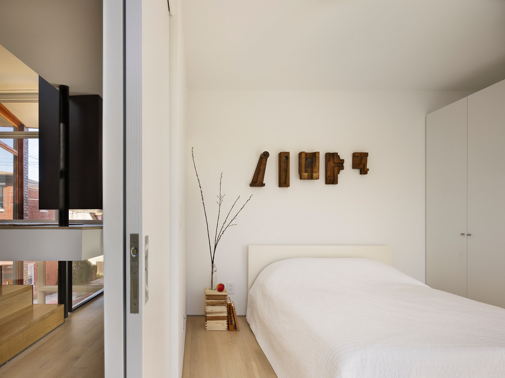 Modern bedroom in Philadelphia with white walls.