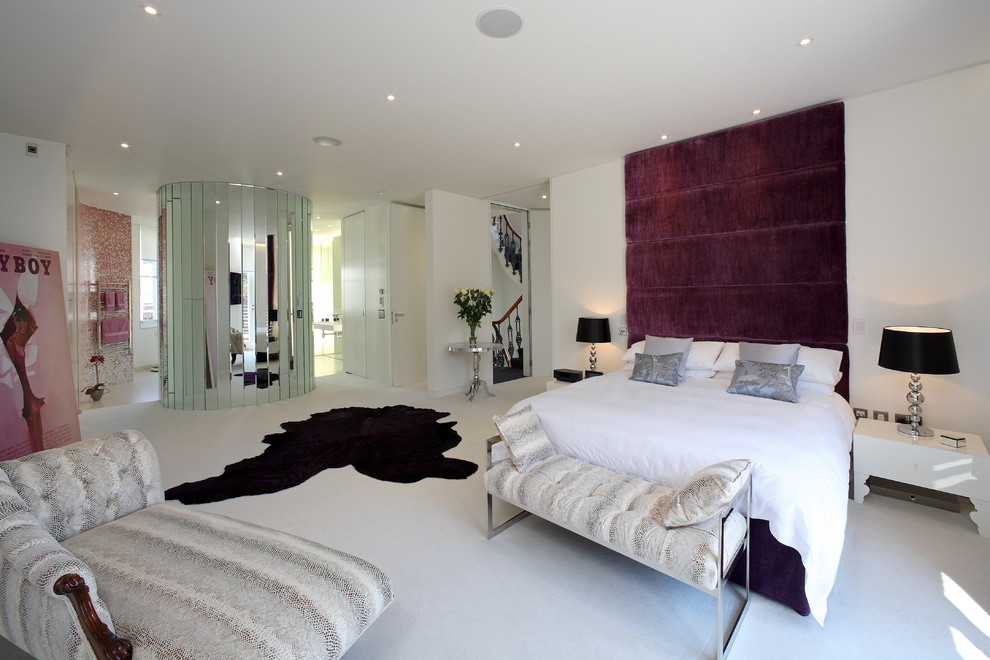 Design ideas for a contemporary bedroom in London with white walls.