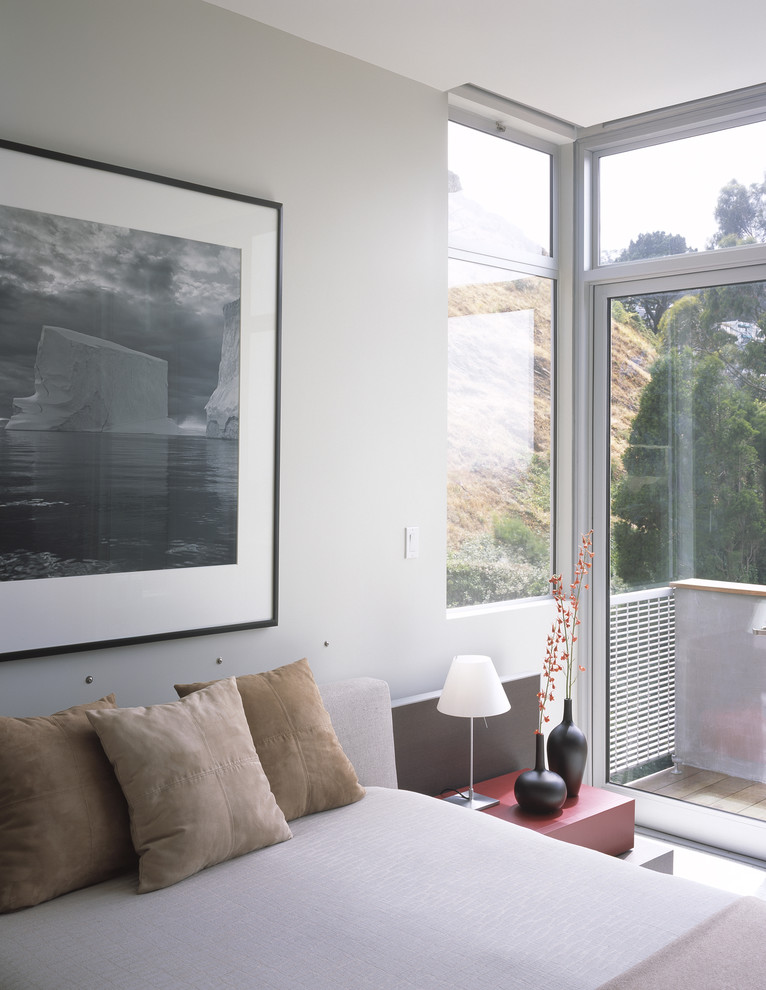 Inspiration for a modern bedroom in San Francisco with grey walls.