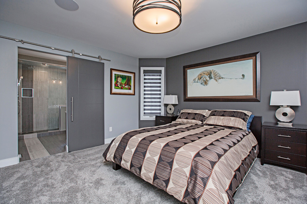 Example of a mid-sized minimalist master carpeted and gray floor bedroom design in Edmonton with gray walls and no fireplace
