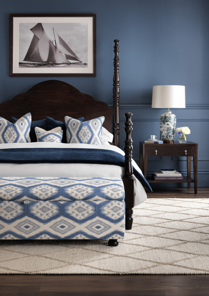 Design ideas for a large coastal master bedroom in London with blue walls, dark hardwood flooring and no fireplace.