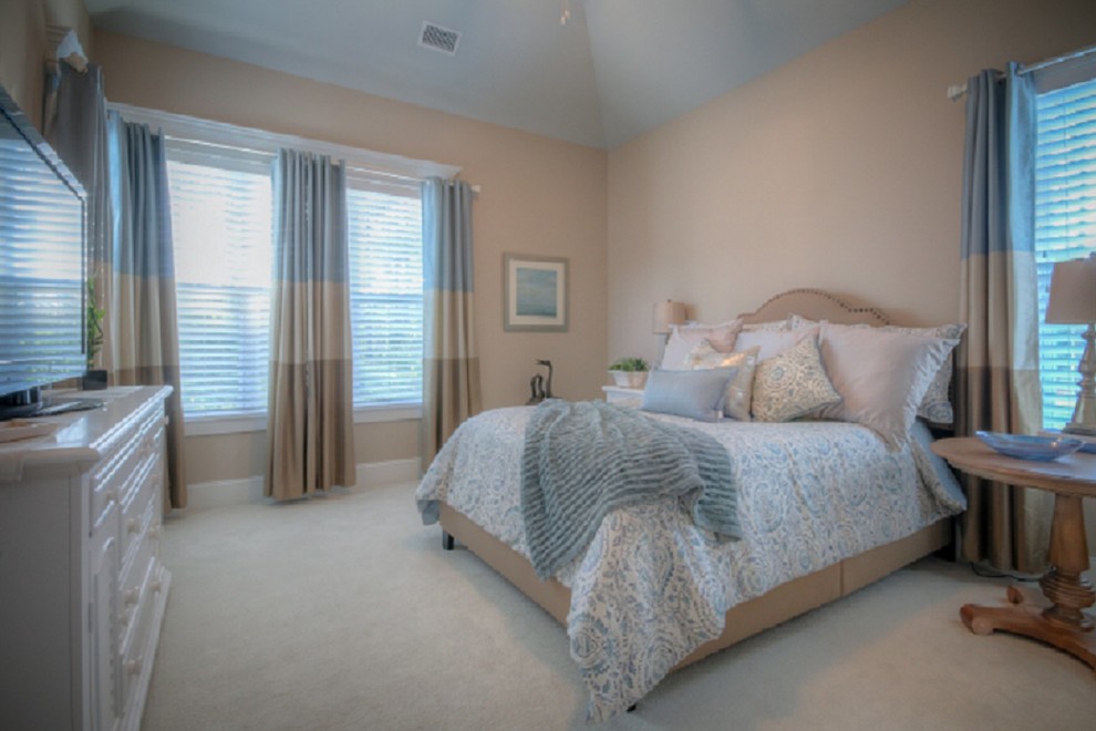 Large beach style master carpeted bedroom photo in Wilmington with beige walls