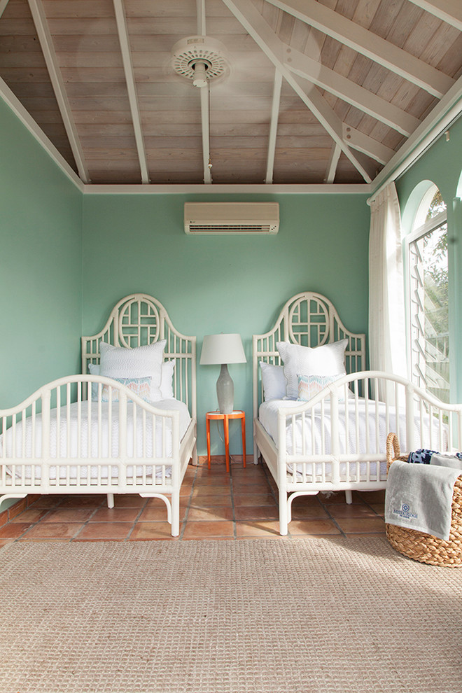 Small island style guest terra-cotta tile and orange floor bedroom photo in Other with green walls and no fireplace