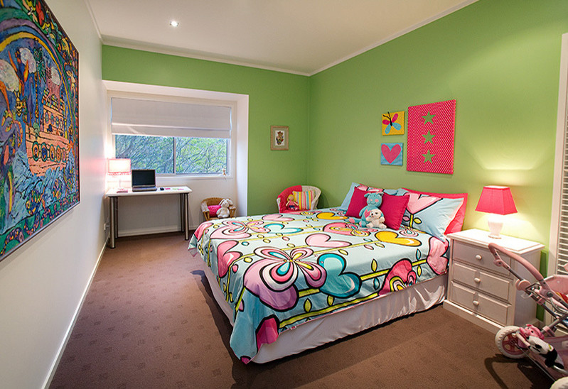 This is an example of a medium sized contemporary bedroom in Brisbane with green walls and carpet.