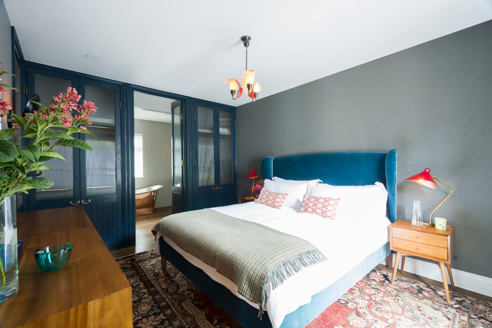 Bedroom - transitional bedroom idea in London with gray walls