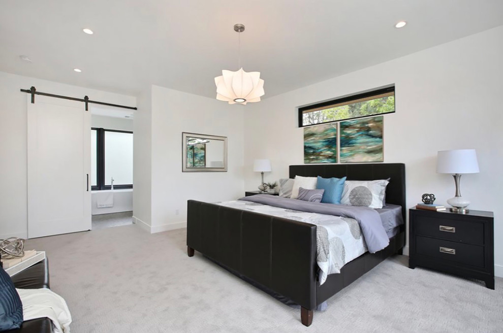 Mid-sized trendy master carpeted and beige floor bedroom photo in Denver with white walls and no fireplace