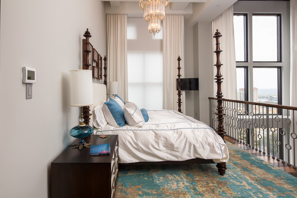 Immagine di una camera da letto stile loft contemporanea con pareti bianche