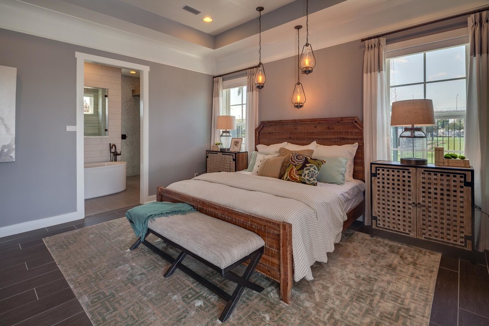 Inspiration for a mid-sized craftsman master laminate floor bedroom remodel in Jacksonville with gray walls and no fireplace