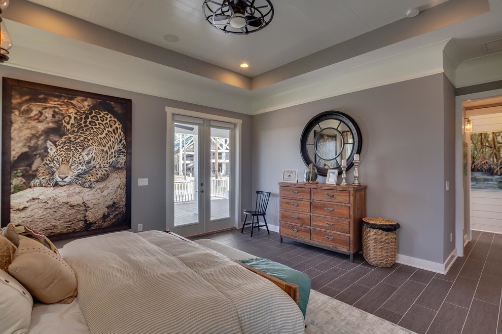 Design ideas for a large traditional master bedroom in Jacksonville with grey walls, laminate floors and no fireplace.