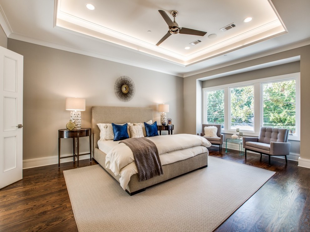 This is an example of a large classic master bedroom in Dallas with grey walls, dark hardwood flooring, brown floors and no fireplace.