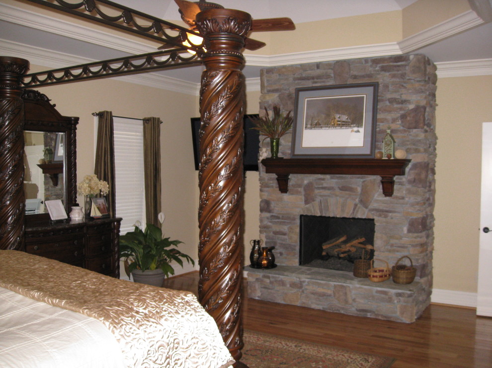 Example of a tuscan bedroom design in Charlotte