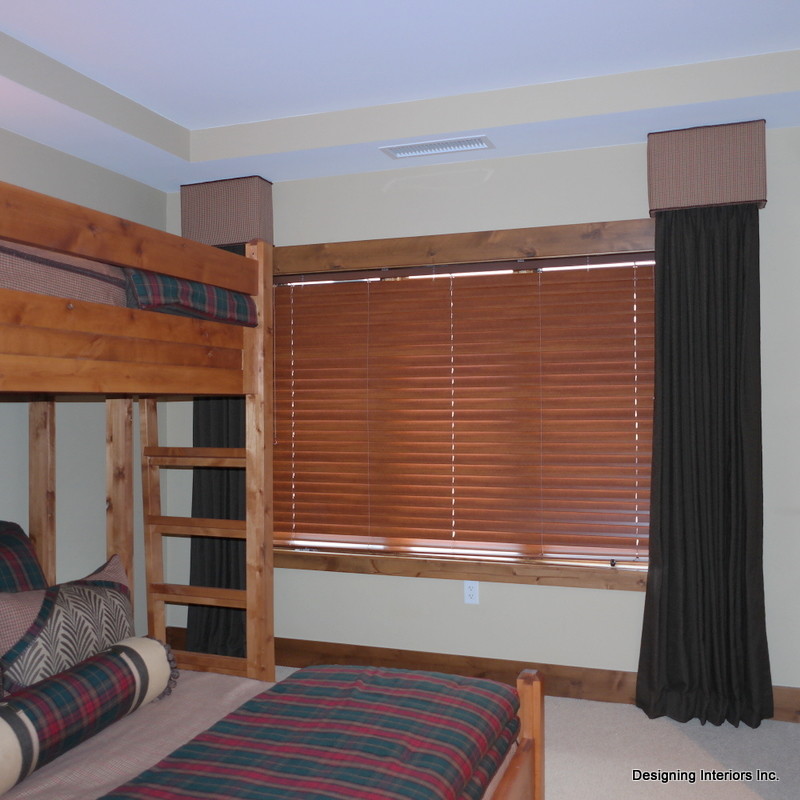 Example of a mid-sized mountain style guest carpeted bedroom design in Denver with beige walls