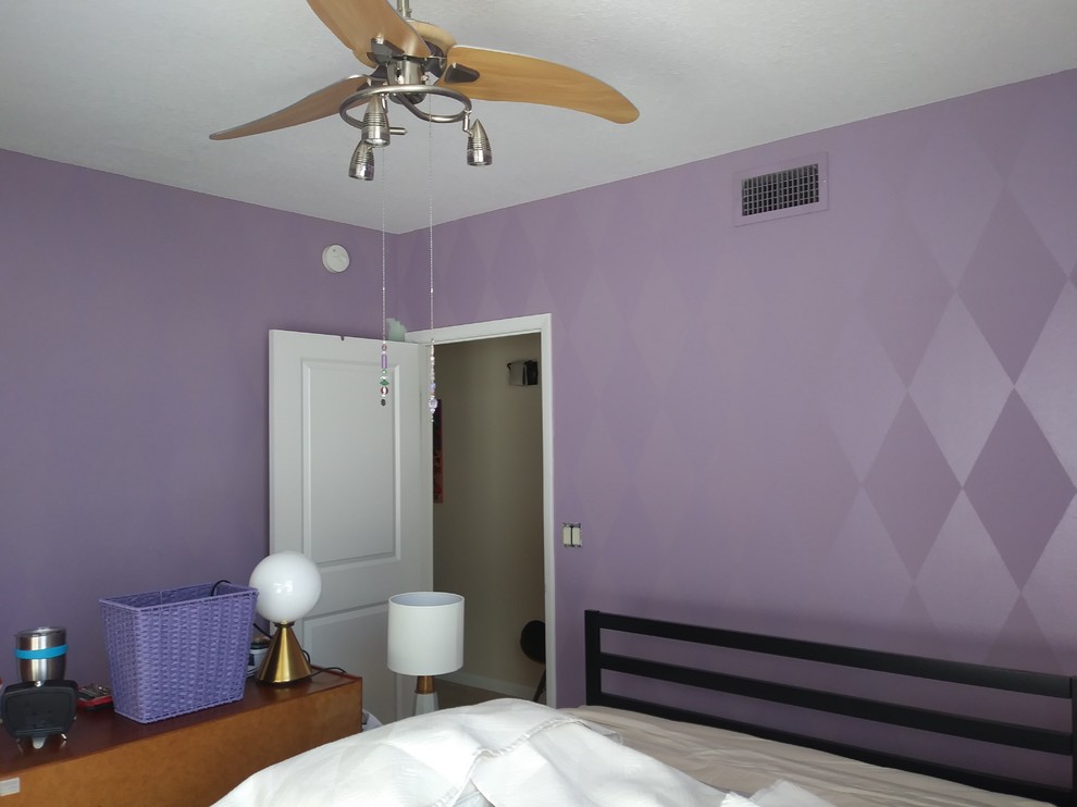 This is an example of a contemporary bedroom in Tampa.