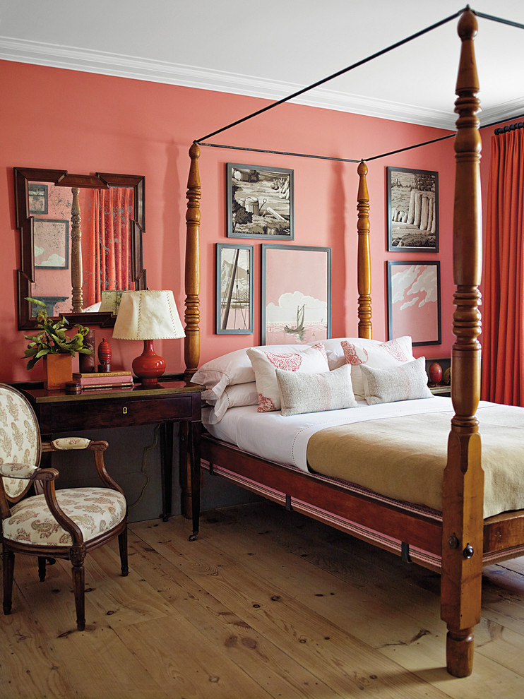 Idée de décoration pour une chambre design avec un mur rose.