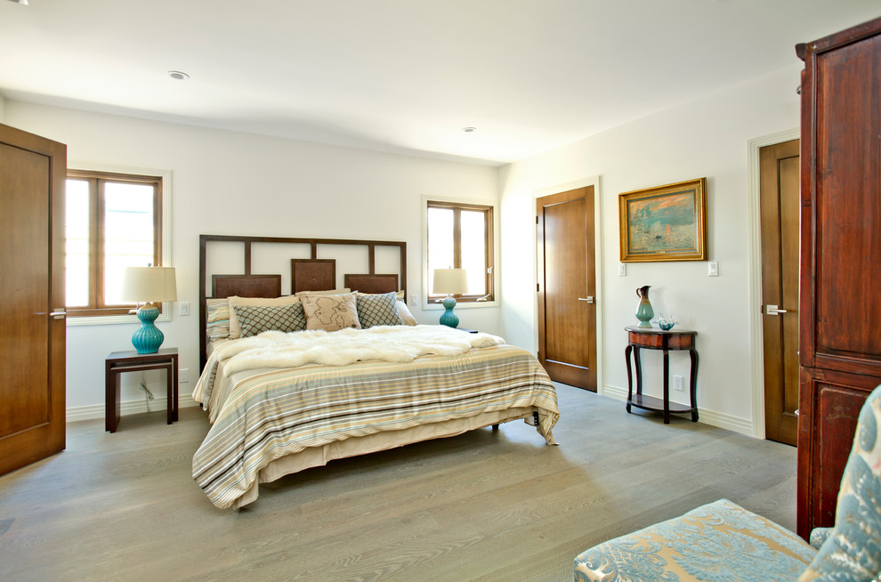 Transitional light wood floor bedroom photo in Los Angeles with white walls