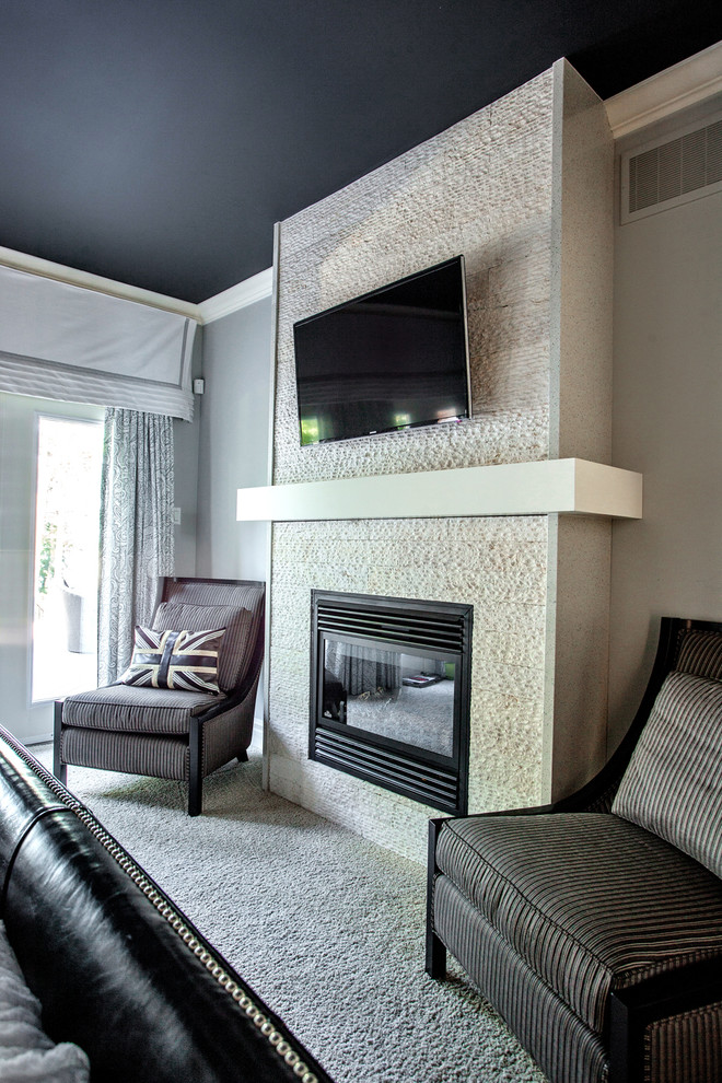 Medium sized contemporary master, grey and cream and grey and silver bedroom in Toronto with grey walls, carpet, a standard fireplace and a stone fireplace surround.