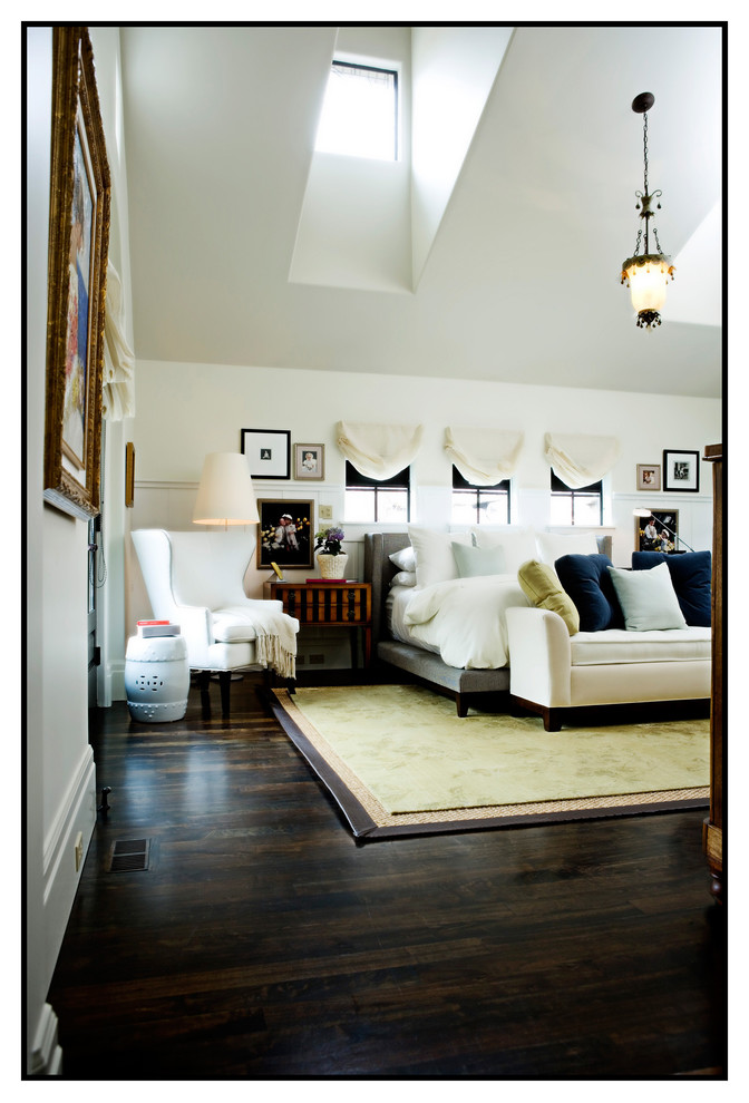 Example of a classic dark wood floor bedroom design in Salt Lake City with white walls