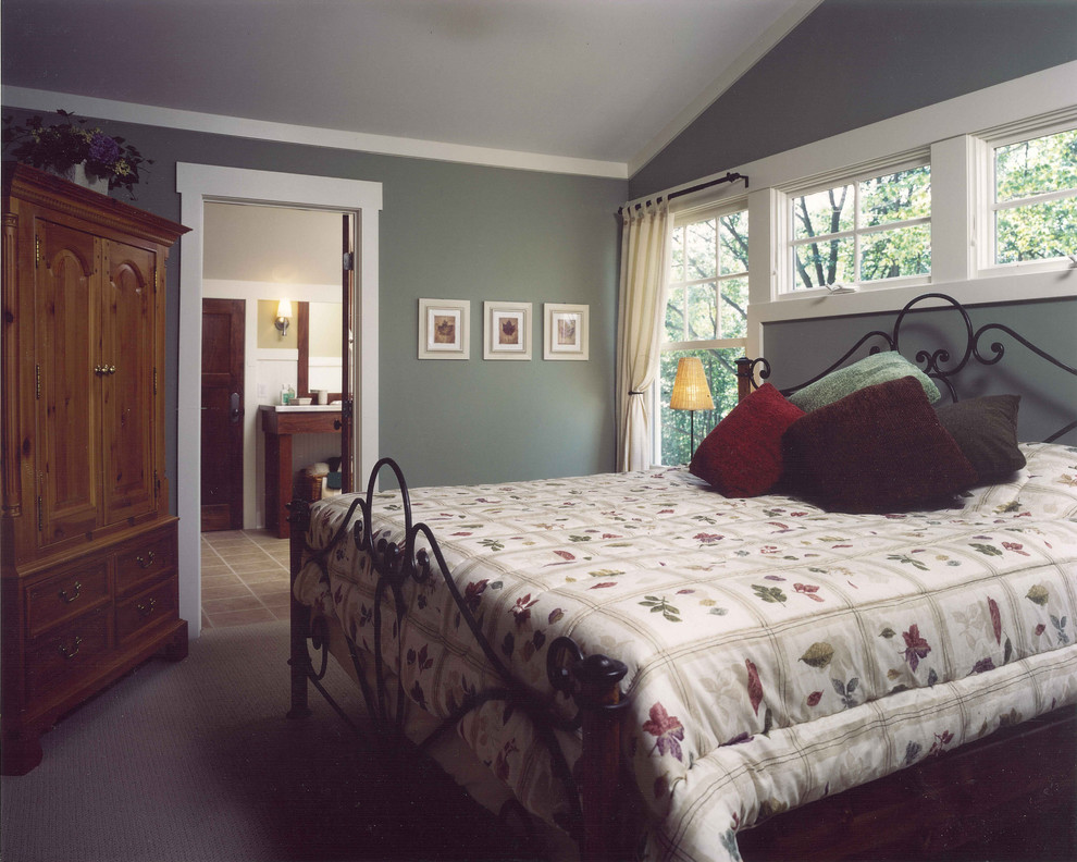 Large traditional guest bedroom in Grand Rapids with blue walls and carpet.