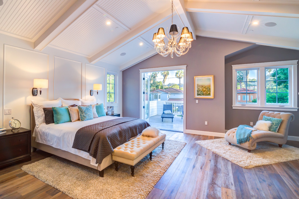 Inspiration for a medium sized classic master bedroom in Los Angeles with purple walls, laminate floors, brown floors and no fireplace.