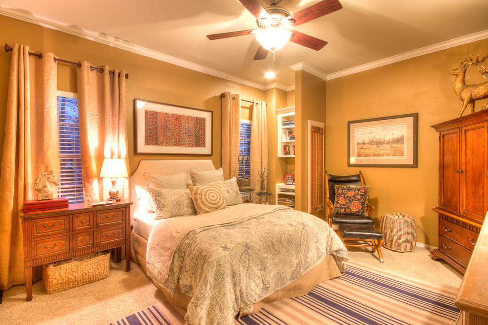 Medium sized bohemian master bedroom in New Orleans with beige walls and carpet.