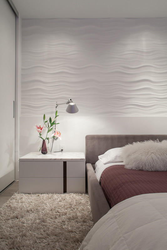 Esempio di una camera degli ospiti minimalista di medie dimensioni con pareti bianche e nessun camino