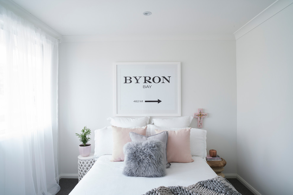 Medium sized modern grey and pink bedroom in Sydney with white walls, carpet, no fireplace and grey floors.