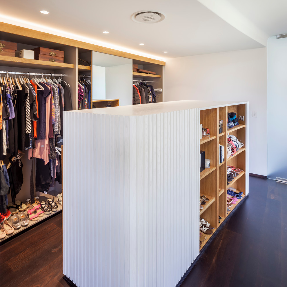 Design ideas for a medium sized contemporary wardrobe in Perth with dark hardwood flooring.