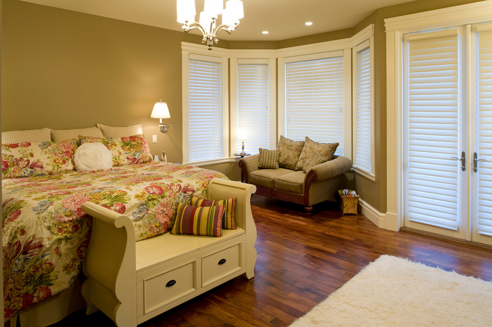 Inspiration for a large classic master bedroom in Calgary with green walls and medium hardwood flooring.