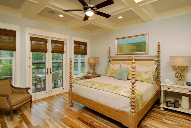 Design ideas for a large beach style master bedroom in Orlando with blue walls, dark hardwood flooring and no fireplace.