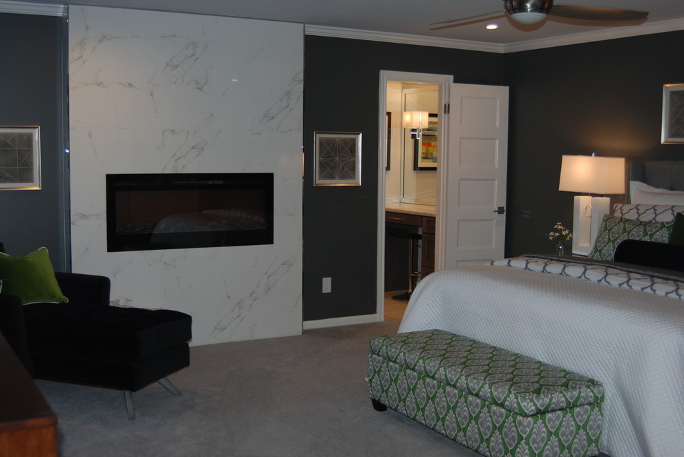 This is an example of a large contemporary master and grey and silver bedroom in Houston with green walls, carpet, a ribbon fireplace and a tiled fireplace surround.