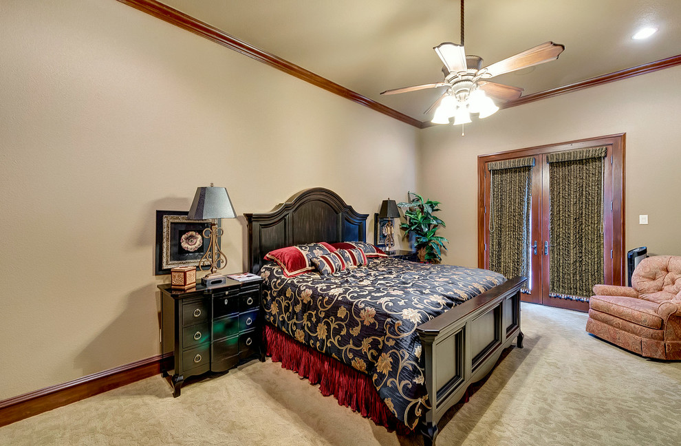 Example of a mid-sized tuscan guest carpeted and gray floor bedroom design in Dallas with beige walls and no fireplace