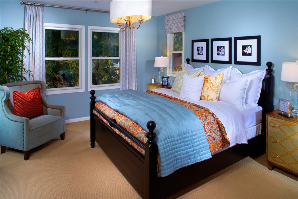 This is an example of a large classic master bedroom in San Francisco with blue walls and carpet.