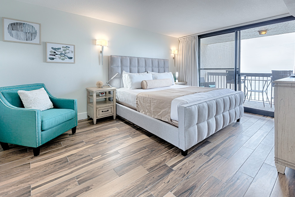 Large elegant master laminate floor and beige floor bedroom photo in Miami with gray walls and no fireplace