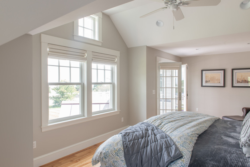 Inspiration for a traditional master bedroom in Boston with grey walls, light hardwood flooring, no fireplace and brown floors.