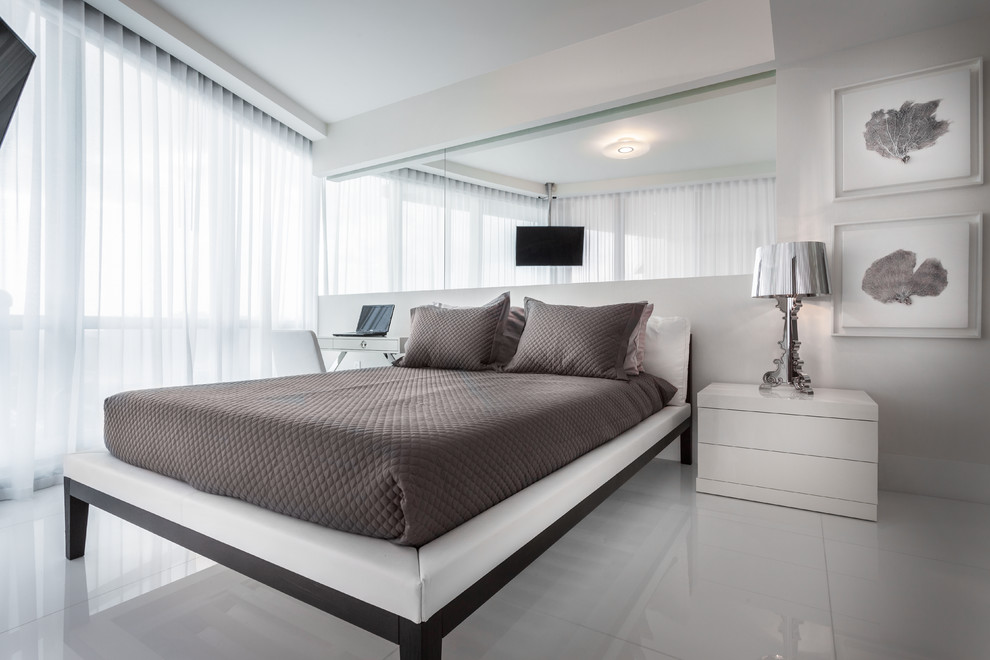 Photo of a medium sized contemporary guest bedroom in Miami with white walls, porcelain flooring, no fireplace and white floors.