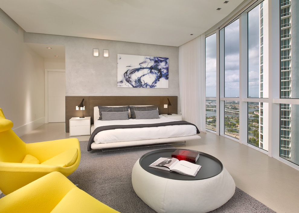 Photo of a large contemporary master bedroom in Miami with white walls.