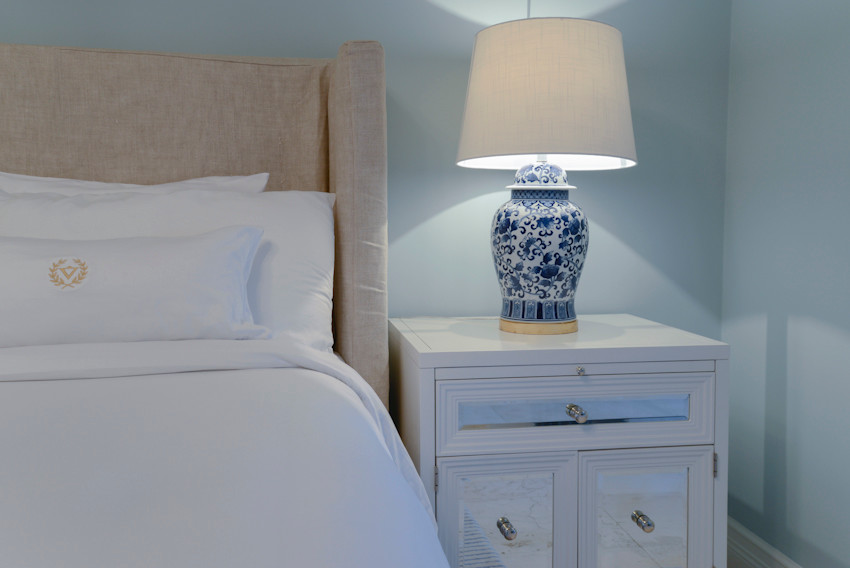 This is an example of a traditional guest bedroom in Miami with blue walls.