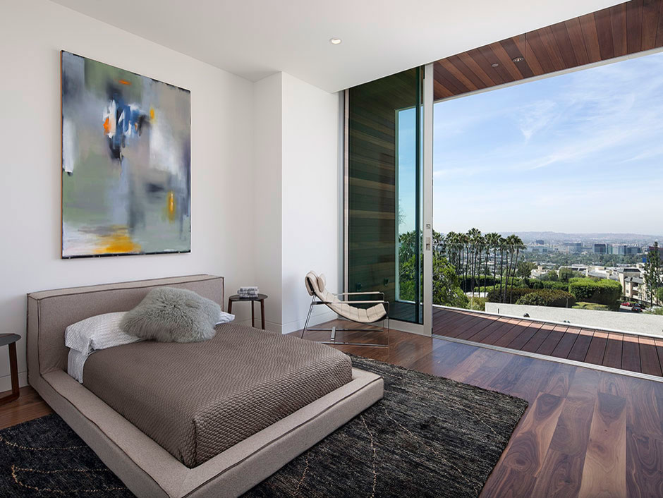 Inspiration for a large contemporary master dark wood floor bedroom remodel in Los Angeles with white walls and no fireplace