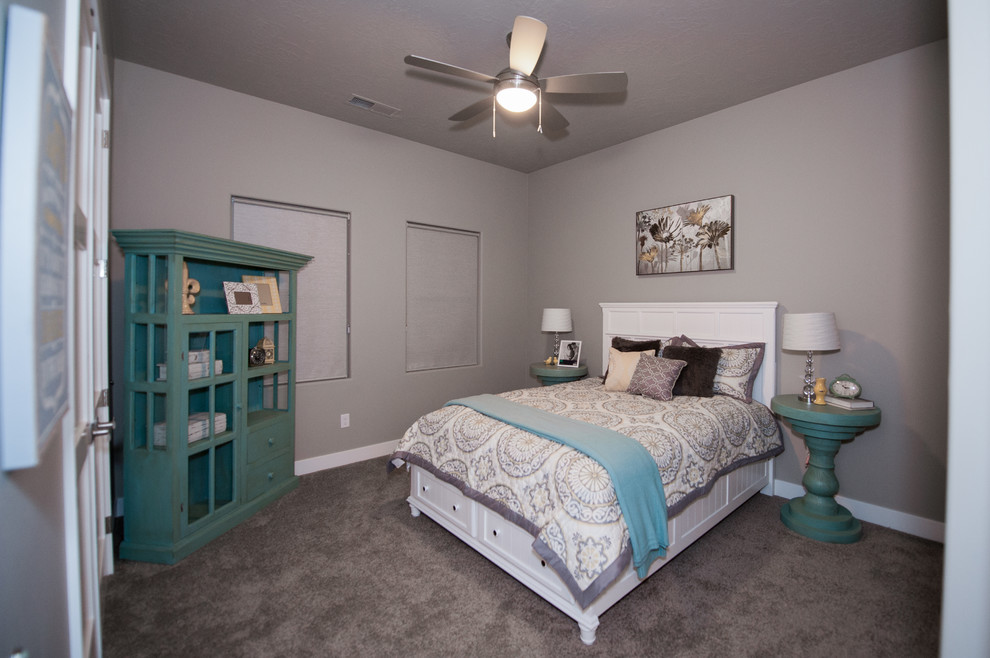 This is an example of a medium sized contemporary guest bedroom in Salt Lake City with grey walls, carpet and grey floors.