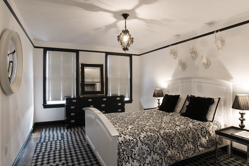 Contemporary cream and black bedroom in DC Metro with white walls, dark hardwood flooring and no fireplace.